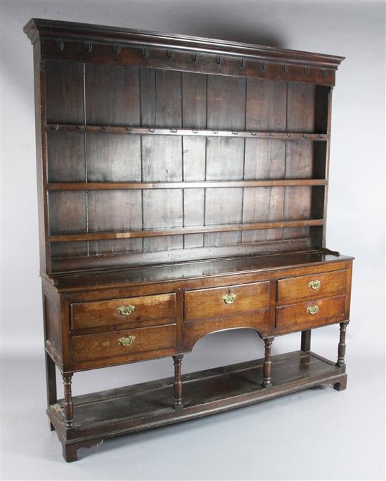 A George III oak dresser, W.6ft 3in. D.1ft 3in. H.6ft 10in.